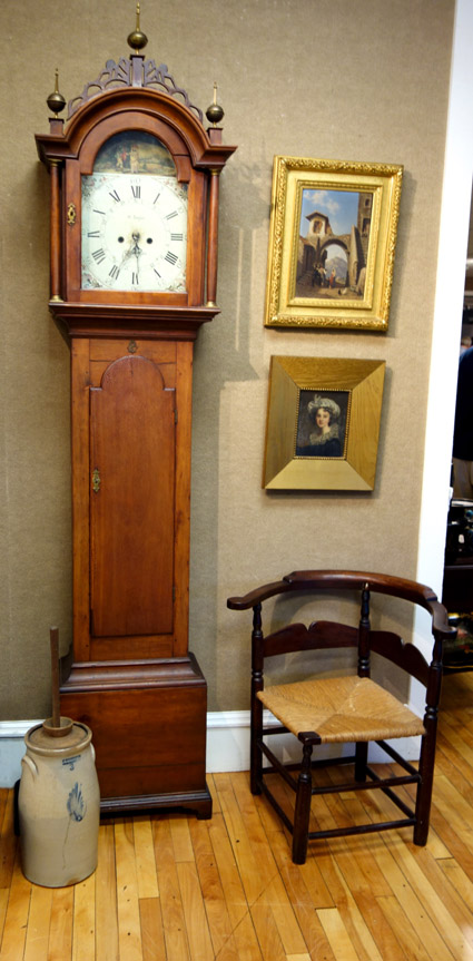 From the Connecticut River Valley, this circa 1820 tall case clock, with three finials and fretwork, sold for $ 920 — “A good buy” Bill Smith said — and the country Queen Anne corner chair brought $ 230.