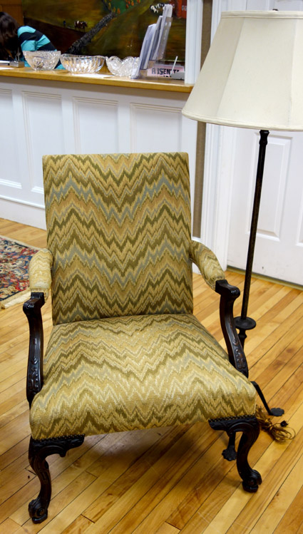 The flame-stitch armchair sold for $ 258.
