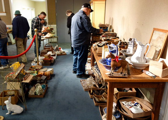 People looked over the objects to be sold and small items were gathered into box lots and put up for bidding during the auction.