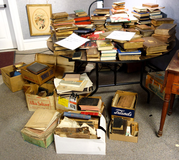 Books, on the table, in boxes and just stacked on the floor, were sold as one lot, bringing $ 632 and lots of work loading them out of the gallery.