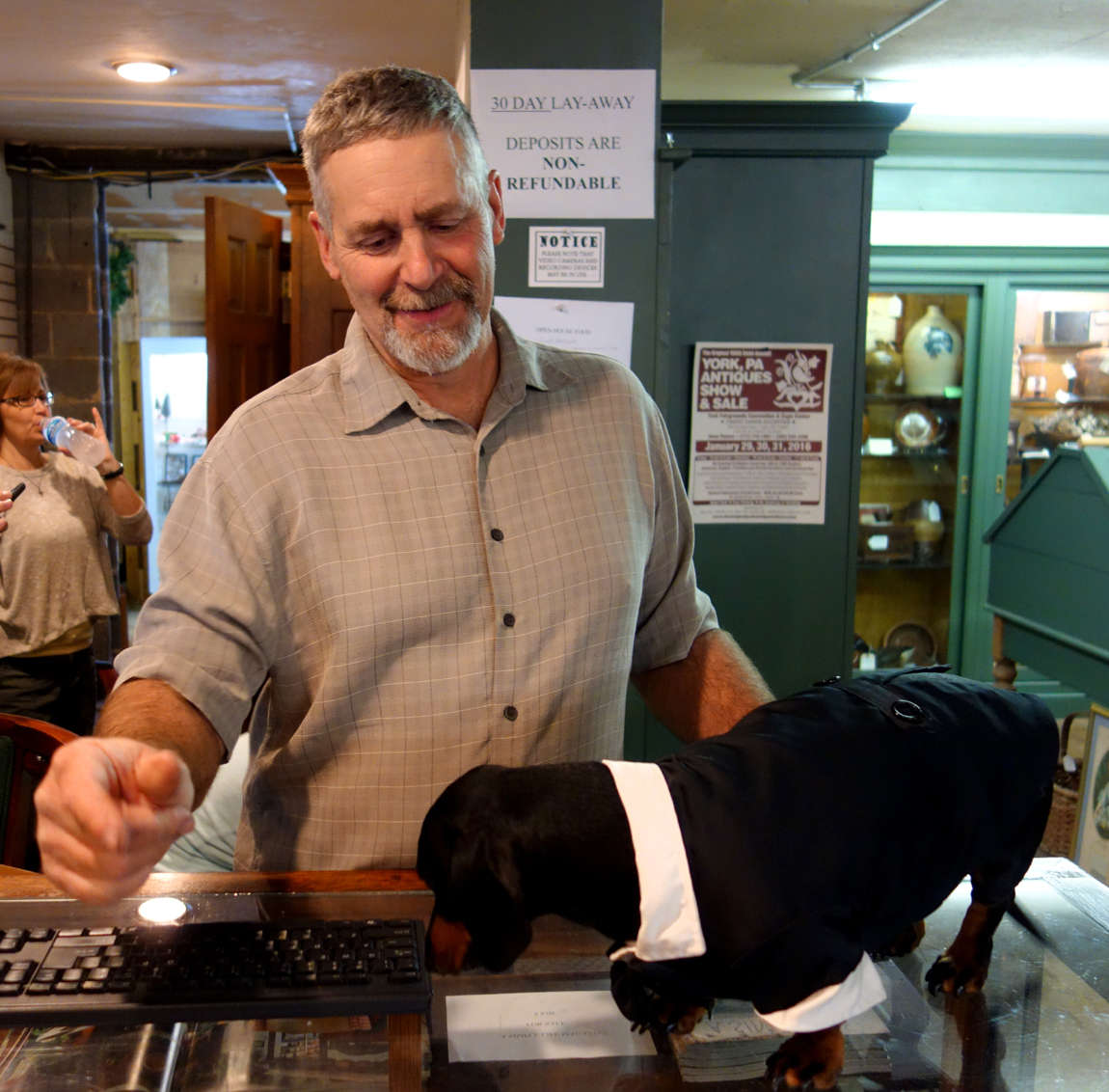 Greg Mummert, owner of Ivy Hall, with his constant companion, Ollie, formally dressed for the open house.
