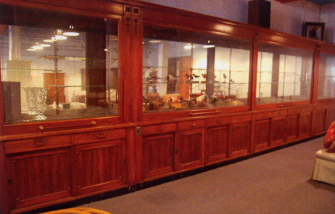 This showcase unit, all handmade with glass front that lifts to gain access, went for $ 4,485. It measures 27 feet long.