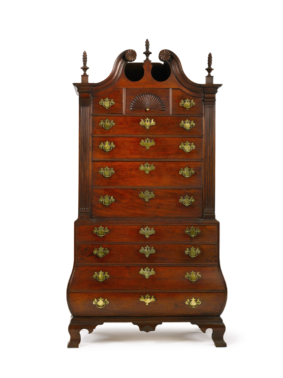 Burnham-Manning family Chippendale carved and figured mahogany bombe bonnet-top chest on chest, probably Salem, Mass., circa 1770, $ 970,000<br>($ 800,000-$ 1 million). Sotheby's Irvin and Anita Schorsch Collection.