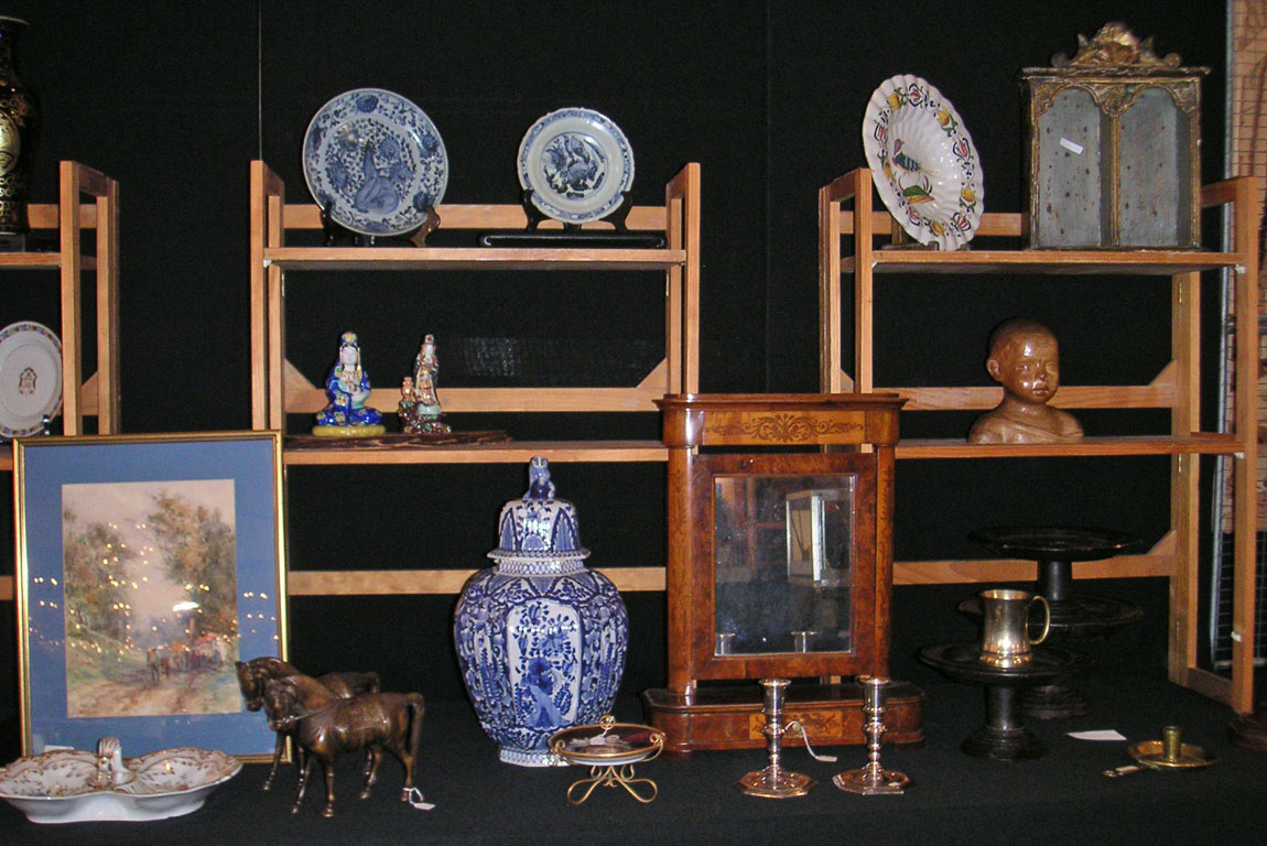 The majority of items shown by Bernie Krauss, West Orange, N.J., were very early, some ancient. The Delft ginger jar at the center of the image was dated 1750s. A vanity mirror made of burl wood and marquetry veneer was made in Austria, circa 1790.