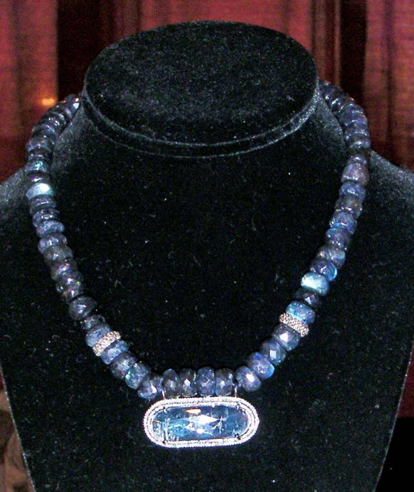 A mid-Twentieth Century carved and faceted labradorite necklace was featured at the booth of Brad & Vandy Reh Fine Jewelry, New Canaan, Conn.