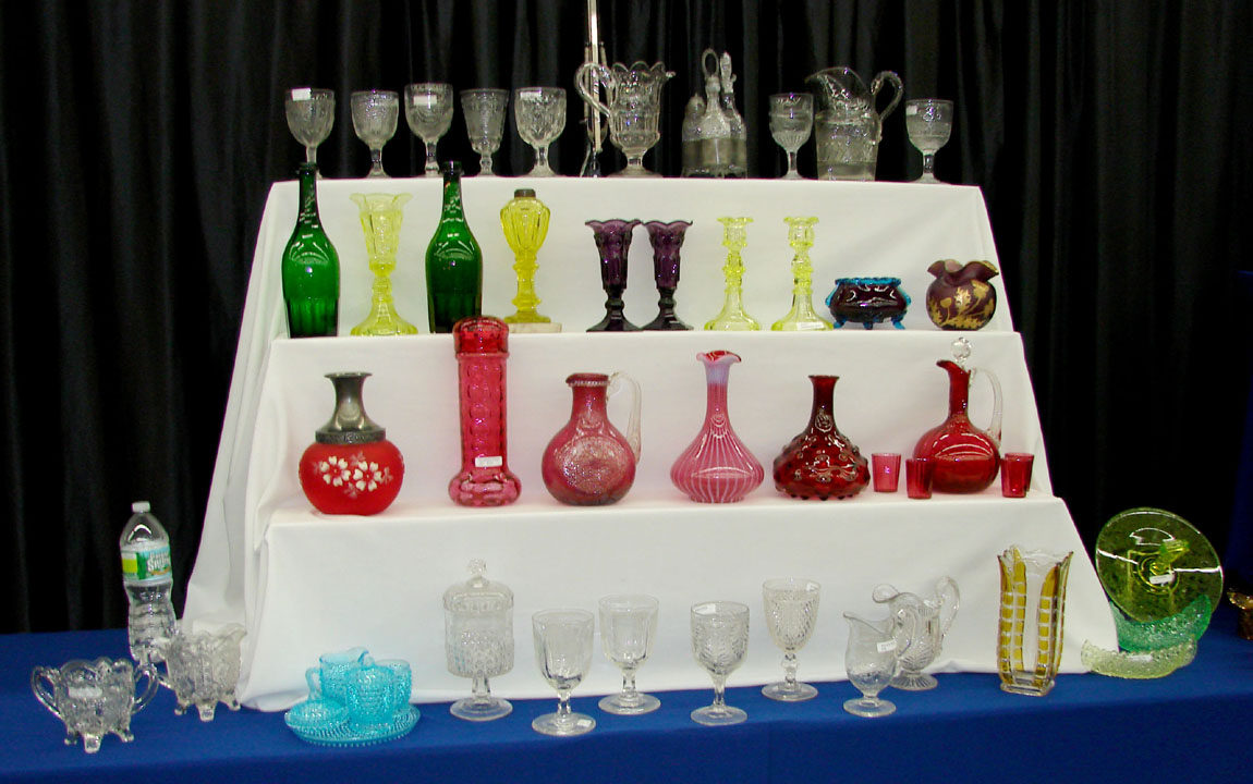 Rose Colored Glass, Ogunquit, Maine, had a selection of pattern glass, a pair of canary Sandwich candlesticks and cranberry glass.