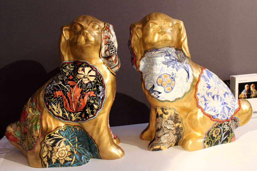 Seen at Ferrin Contemporary, North Adams, Mass., a pair of “Camouflage Dogs (William Morris),” 2015, by Stephen Bowers, slip cast earthenware, underglaze decoration on-glaze burnished gold luster, 17¾ by 15¼ by 7 inches each.