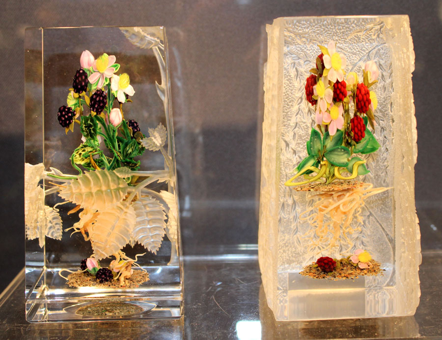 Among a showcase full of antique and contemporary paperweights, Alan and Susie Kaplan of Leo Kaplan Ltd, New York City, had these rare collaborative botanical carved examples by Paul Stankard and noted glass artist Barry R. Sautner, who died in 2009. One of two known, the example on the right has raspberries, blossoms, roots and spirits. It was sandblasted by Sautner on three sides with weeping willows.