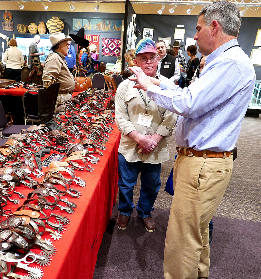 San Antonio spur expert Bruce Bartlett talks to a dealer.