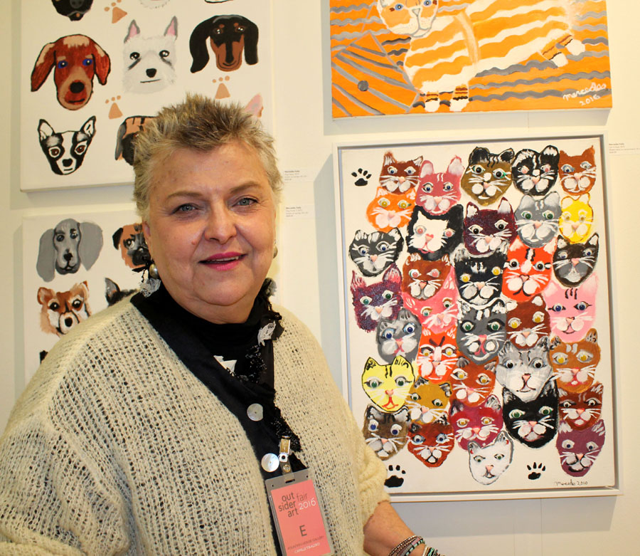 Camille Tibaldeo, communications director at Fountain House Gallery, New York City, representing artists living with mental illness, with a series Mercedes Kelly's (b 1962) acrylic on canvas board portraits of cats and dogs, including "Cat Collage," 2010, mixed media on canvas, 25 by 18 inches. Tibaldeo and the gallery's director Ariel Willmott said sales were gratifying, despite the snowstorm. "This year's Outsider Art Fair provided us with another wonderful opportunity to meet prominent collectors," said  Willmott. "This exposure to a wider audience is invaluable."