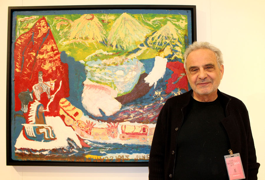 Roger Ricco, co-principal of Ricco/Maresca Gallery, New York City, with a work by Kentucky artist William Hawkins (1895-1990), who appropriated images from newspapers, magazines and advertisements and combined them with his own recollections and impressions to create a vivid picture gallery of animals, Americana and historic events.