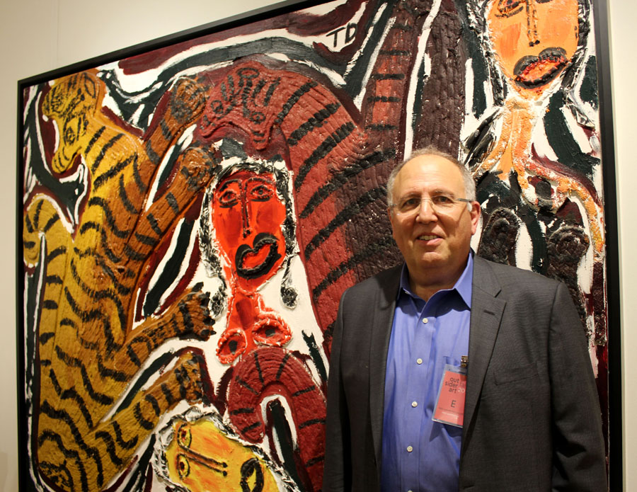 New Haven, Conn., gallerist Fred Giampietro with a large 1989 mixed media titled "Smooth Going Cats," 1989, by Thornton Dial, who recently passed away.