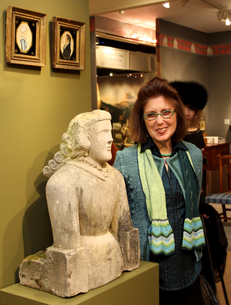 Nancy Glazer admires a stone carving of a woman, Ohio, circa 1850–60,<br>at Elliott and Grace Snyder Antiques, South Egremont, Mass.