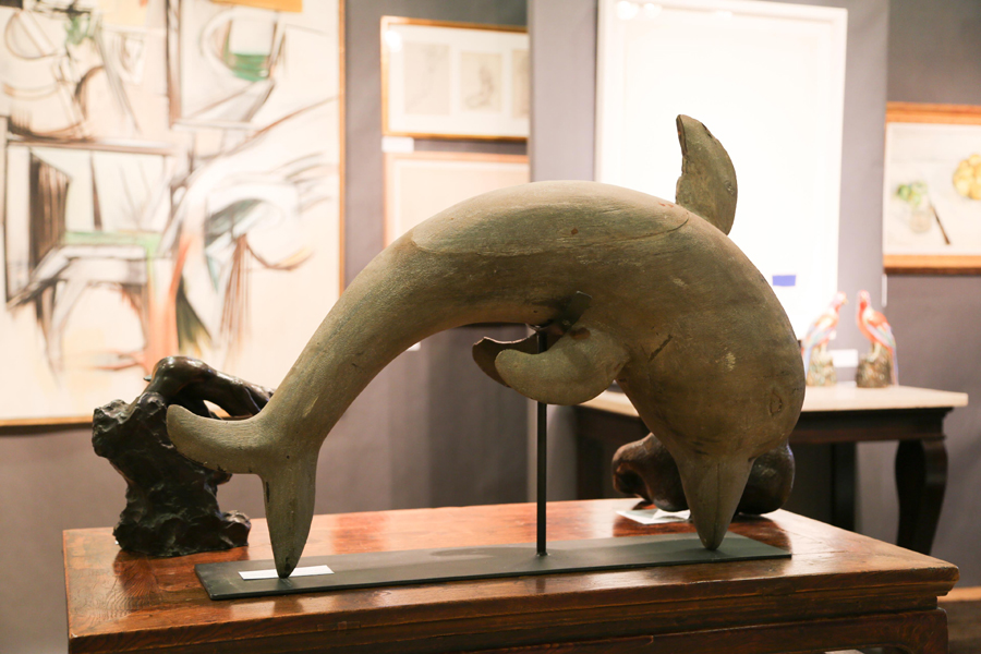 A folk art carved wood whale sat before an abstract work<br>by Ernest Acker-Gherardino at Framont, Greenwich, Conn.