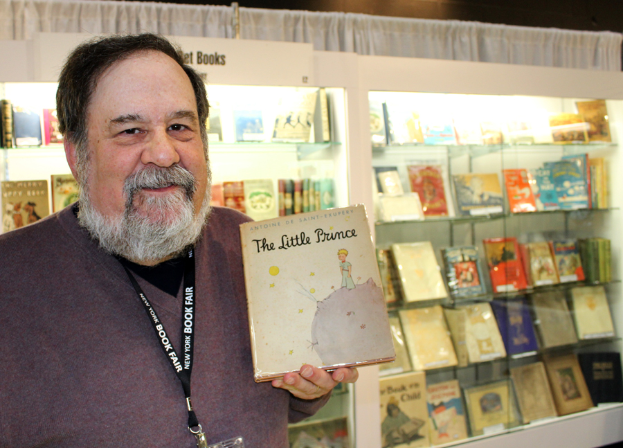 Marc Younger of Aleph-Bet Books,  Inc, Pound Ridge, N.Y., with <i>The Little Prince</i>, just one of the children’s titles available in the firm’s showcases.