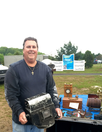 This Ansonia, Conn.-based dealer, who  goes by the nickname “44 Coldcuts,” holds up a fine B-52 bomber camera that came in its original case<br>having lenses and film rolls.
