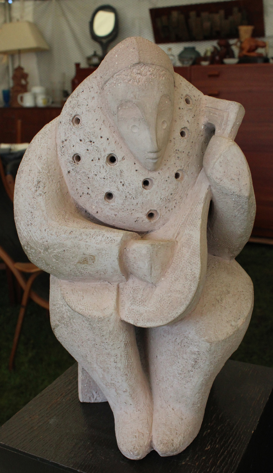 Picasso-esque, this terracotta handmade sculpture<br>awaits a buyer at ModHaus, Boston. —Heart-O-The Mart