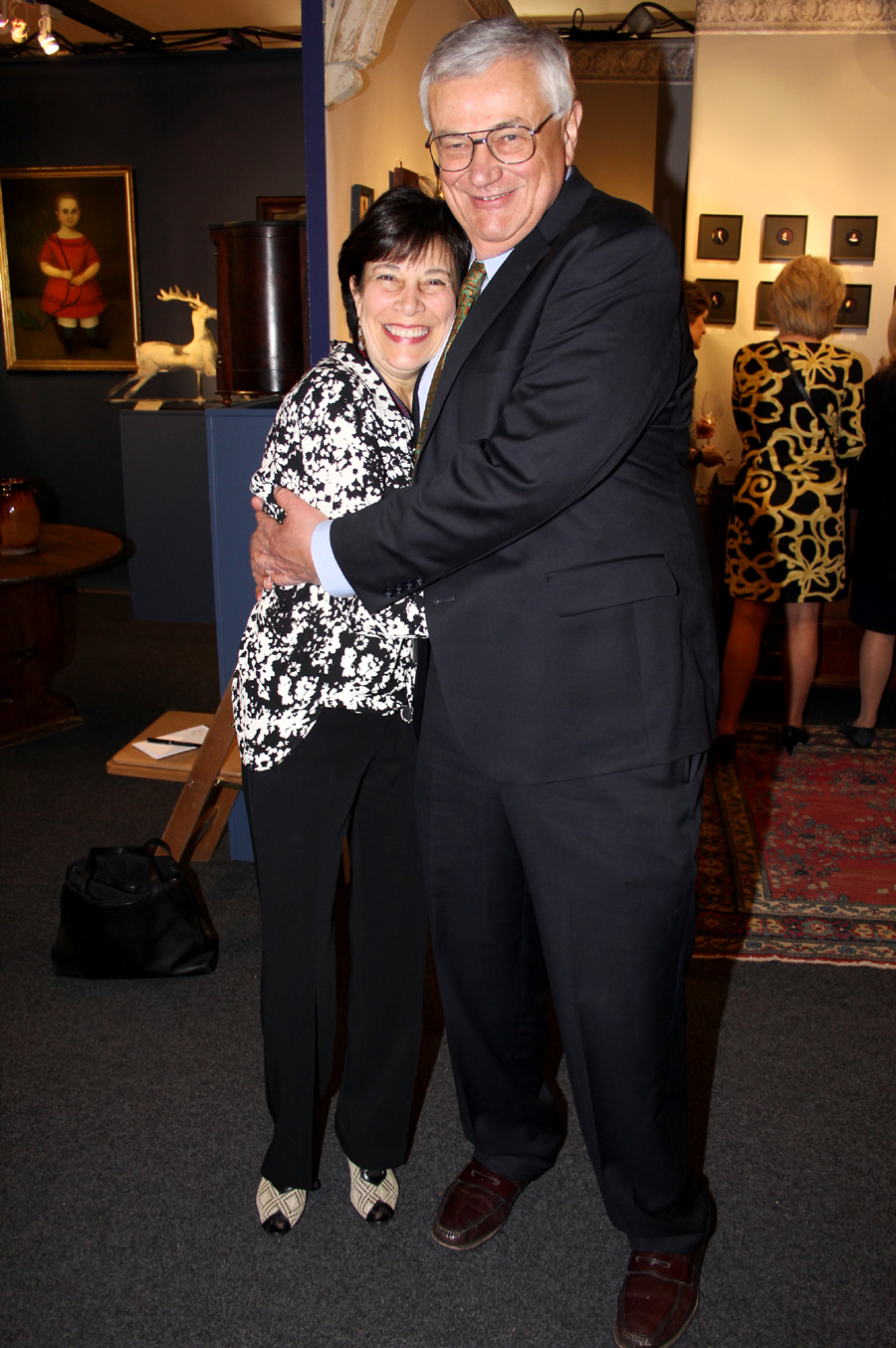 Sally Herrup of Sheffield, Mass., gets a hug from New Hampshire<br>auctioneer Ron Bourgeault, her former employer.