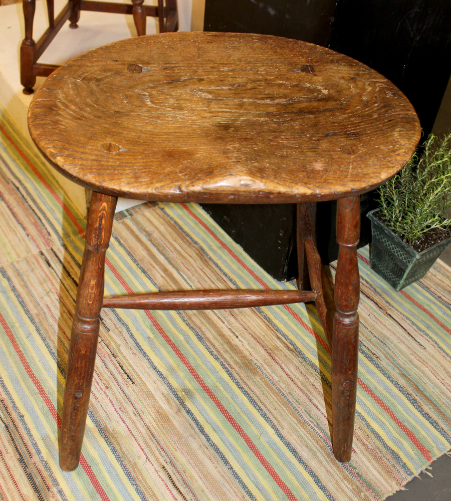 Used by a loom-worker, the stool's unusual height<br>would have allowed operation of a foot treadle.