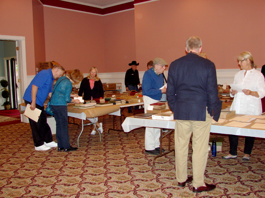 Numerous buyers checked out the neatly displayed books and manuscripts.