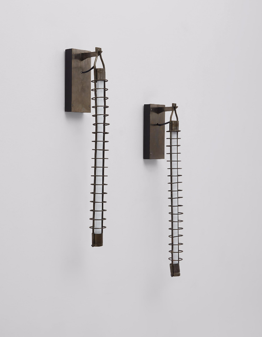Franco Albini created seven of these wall lights for the National Institute of Assurance Office Building, with one on each landing of the stairs in the building. This pair brought $ 175,000 at Phillips, tripling the high estimate.