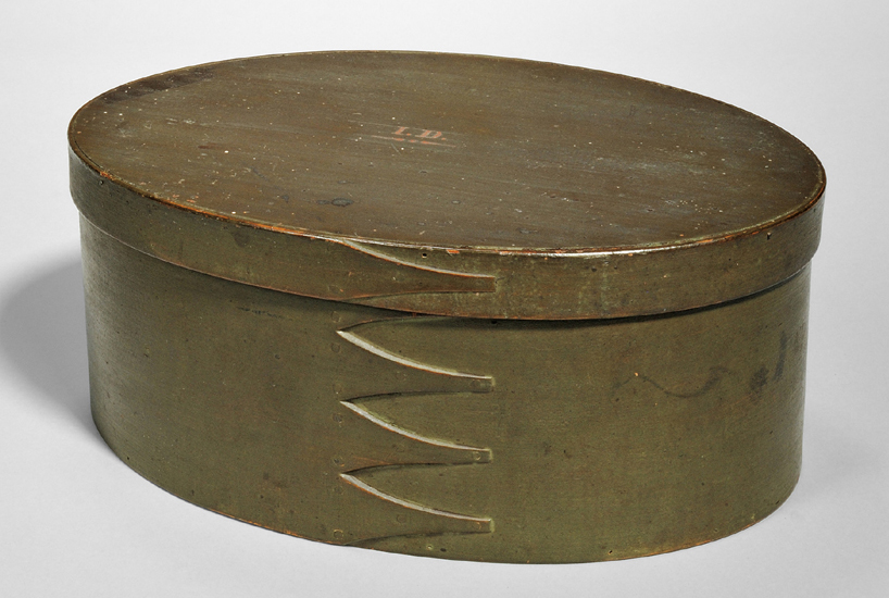 Olive green painted oval covered box, Mount Lebanon, N.Y., circa 1881,<br>$ 18,450 ($ 8/12,000). Inscribed “Presented to Amelia Joslin March 29, 1881 by Sister Dana Brewster” and marked in red “I.D.,” possibly James Daniels.<br>Dana Brewster was a ministry eldress at Hancock, Mass. She gave this box to a younger Shaker sister who entered the Shaker Society at Hancock’s Second Family in 1843. Collection of Erhart Muller.