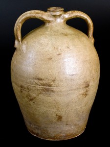 Alkaline-glazed double-handled stoneware jug, incised “Dave” and impressed “C,” Dave at the John or Abner Landrum Potteries, Horse Creek Valley or Pottersville, Edgefield District, S.C., circa 1825–35, $46,000 ($10/$20,000). This may be the earliest signed “Dave” vessel and the only one with double handles.