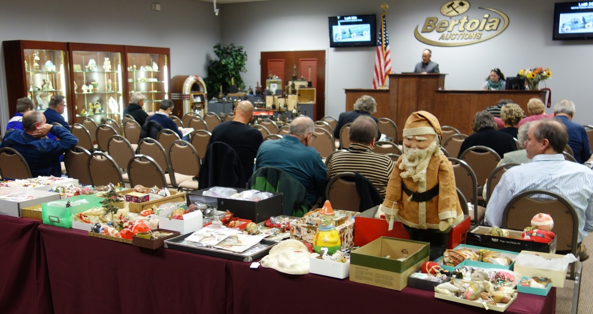 About 25 people were in the gallery on Friday, with a larger group on Saturday and a full house on Sunday. Pictured in the foreground is a portion of the box lots that are sold at the end of the catalog sale on Sunday.