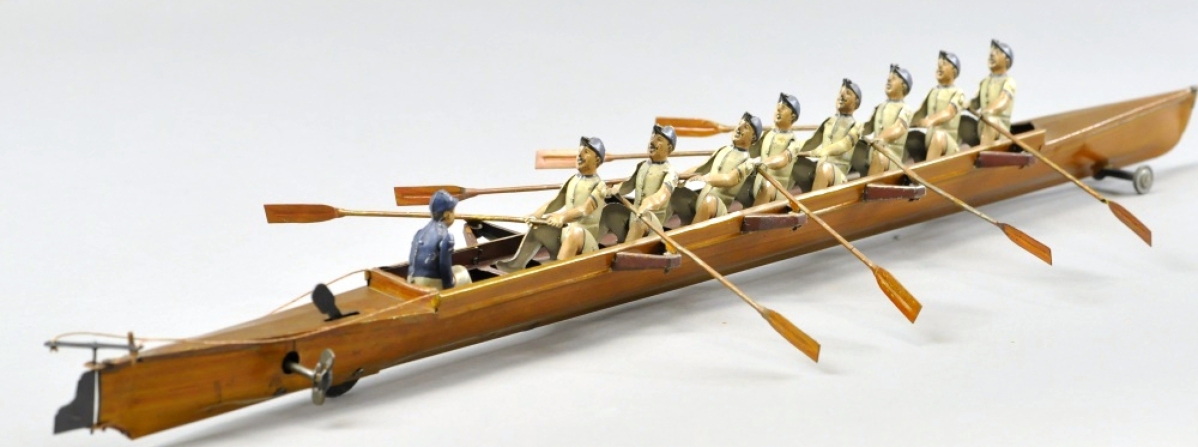 This Gunthermann Eight-Man Scull, Germany, lithographed tin, blue and white striped uniforms, clockwork-driven, 28 inches long, pristine condition, ex Dick Claus Collection, brought $20,060, with a high estimate of $17,000.