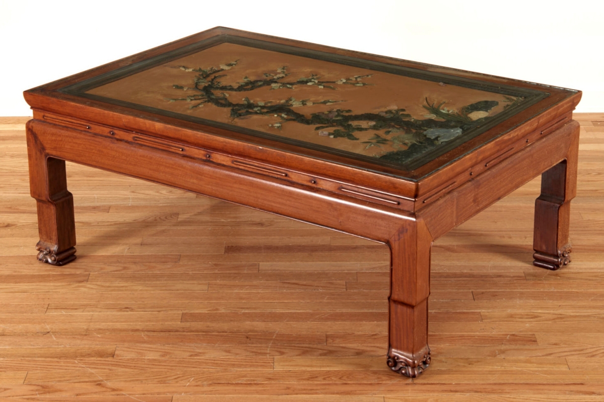 The top lot of the auction was an antique Chinese jade and hardwood low table, Nineteenth Century, possibly huanghuali, with hardstone elements, achieving $48,000.