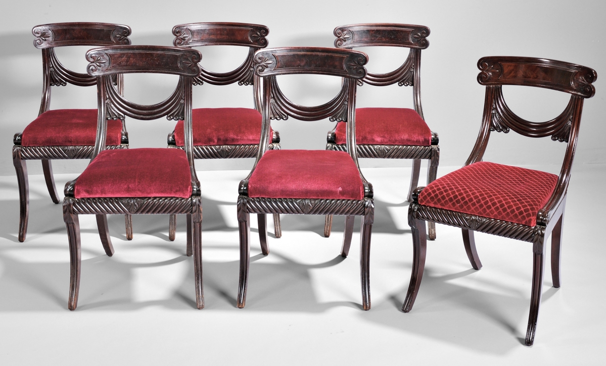 A set of eight carved mahogany and mahogany veneered Grecian side chairs were the highest priced lot of the sale. Possibly from a Boston house designed by Charles Bullfinch, the set realized $79,950.