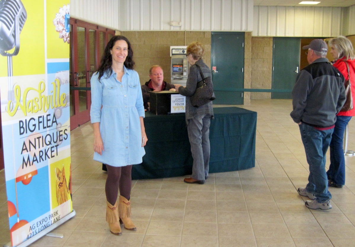 Marthia Sides greets the first shoppers on Saturday morning at the AG Center.