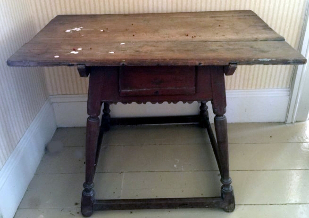 The top selling piece of early furniture was this splay-legged tavern table with a nicely scalloped apron and a drawer. It went out for $4,255 to a dealer in the room.