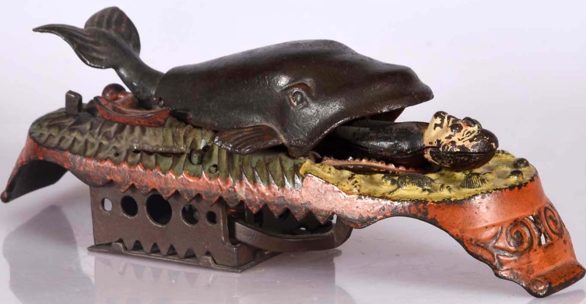 The Jonah & Whale cast iron mechanical bank by J&E Stevens sold in the gallery for $25,200, just over the low estimate. A coin is placed near the whale’s tail and when the lever is moved, the coin drops into the bank and Jonah appears from the mouth of the whale. The catalog notes, “It is an extremely difficult bank to find in this much original condition.”