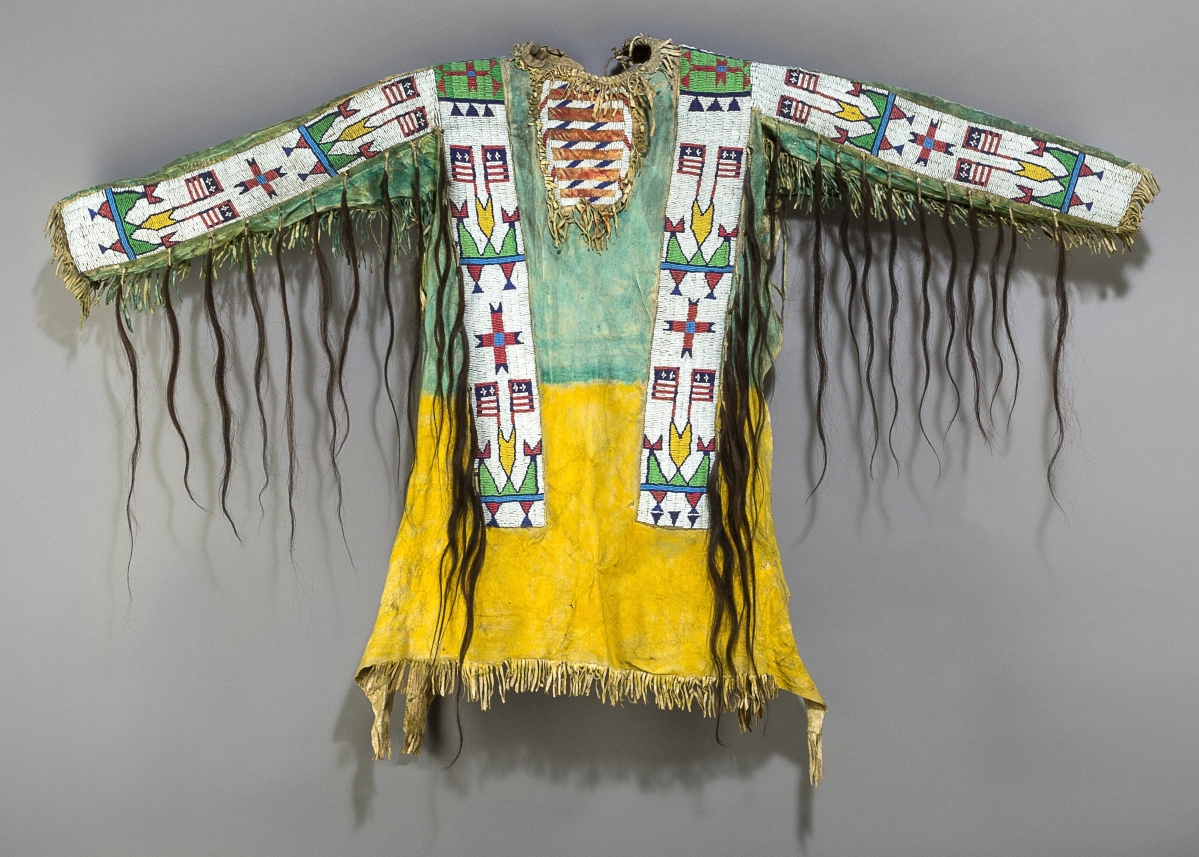A Sioux pictorial beaded hide war shirt, circa 1890, with human hair fringes was the subject of many bids that pushed it to $32,500.