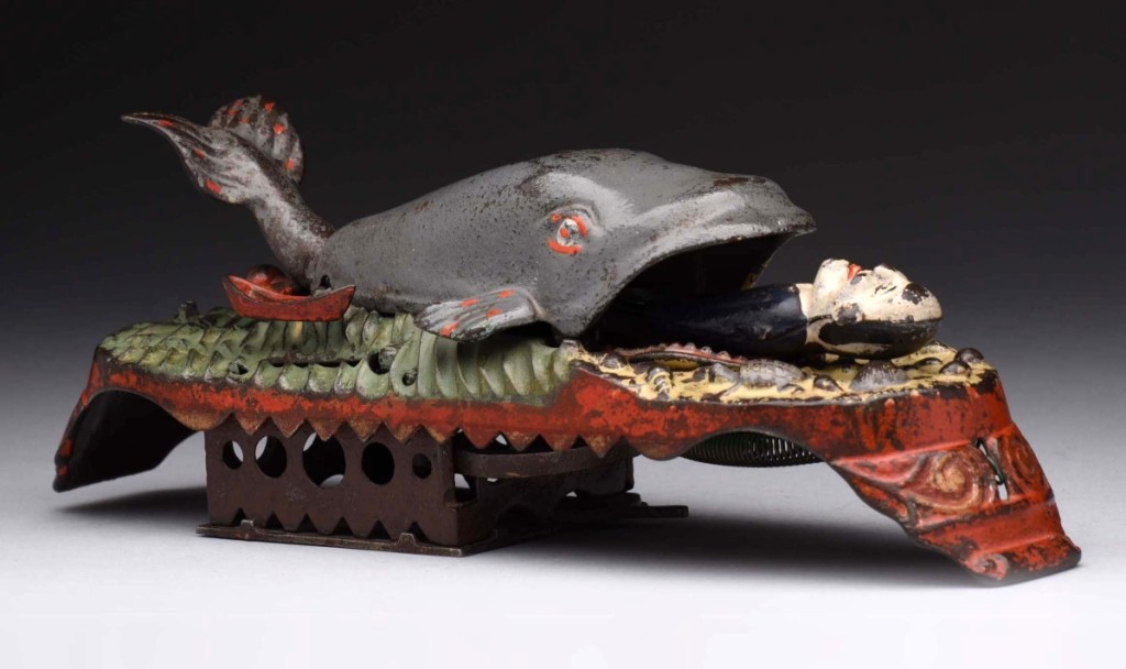 The biggest splash of the day came when lot 341, Jonah & The Whale cast iron mechanical bank, crossed the block, selling for $119,925, well over the $80,000 high estimate. This bank, made by J&E Stevens, measures 11¼ inches long, is in excellent condition, and has a light clear coat all-over. To operate the bank, pull back the knob located behind the whale’s tail to lock it in position. Place a coin in the small boat next to the whale’s tale and press the lever. The coin falls into the bank as the whale opens its mouth and Jonah emerges.