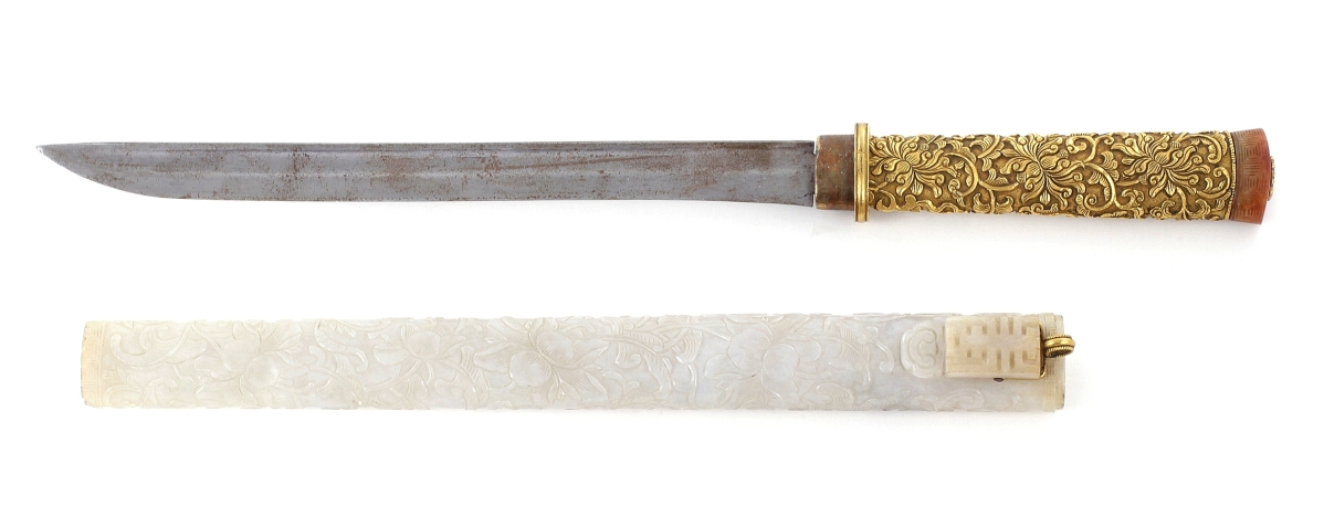 This 13½-inch-long Qing Dynasty Chinese gilt-bronze knife in a carved white jadeite scabbard descended from Millicent Rogers to her second son, Arturo Peralta Ramos Jr ($30/50,000).