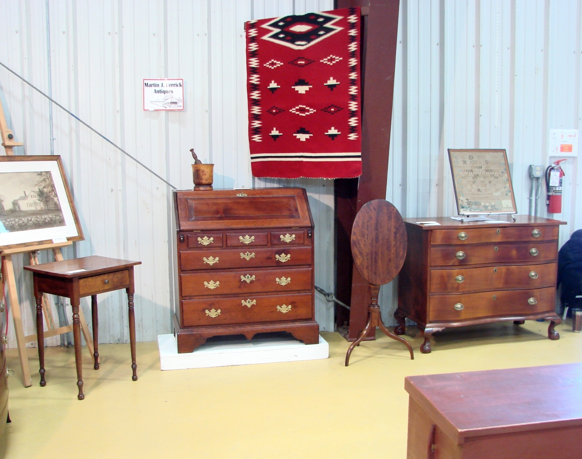 The cherry Queen Anne desk was in the booth of Martin Ferrick, Lincolnville, Maine. It was priced at $2,400.