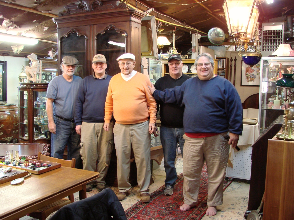 Harvey Webber, barefoot and at right, and the rest of his crew are seen prior to the start of the auction.