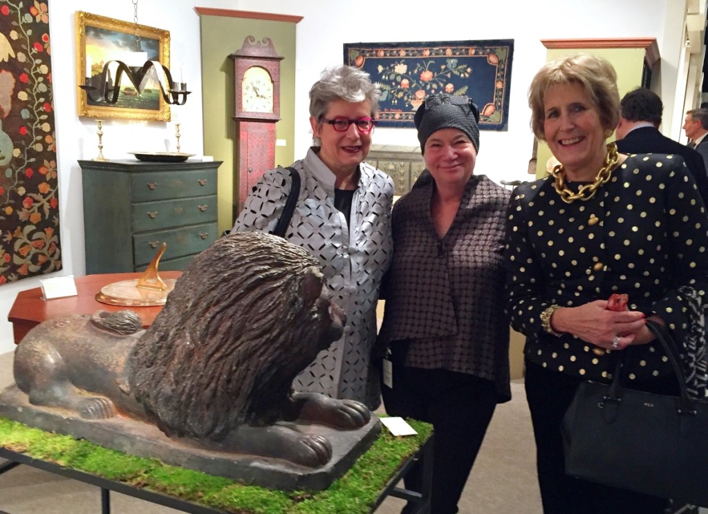 From left, Winterthur’s chief curator Linda Eaton, Grace Snyder and dealer and show manager Diana Bittel examine a glazed stoneware lion of circa 1830 at Elliott & Grace Snyder Antiques, South Egremont, Mass.