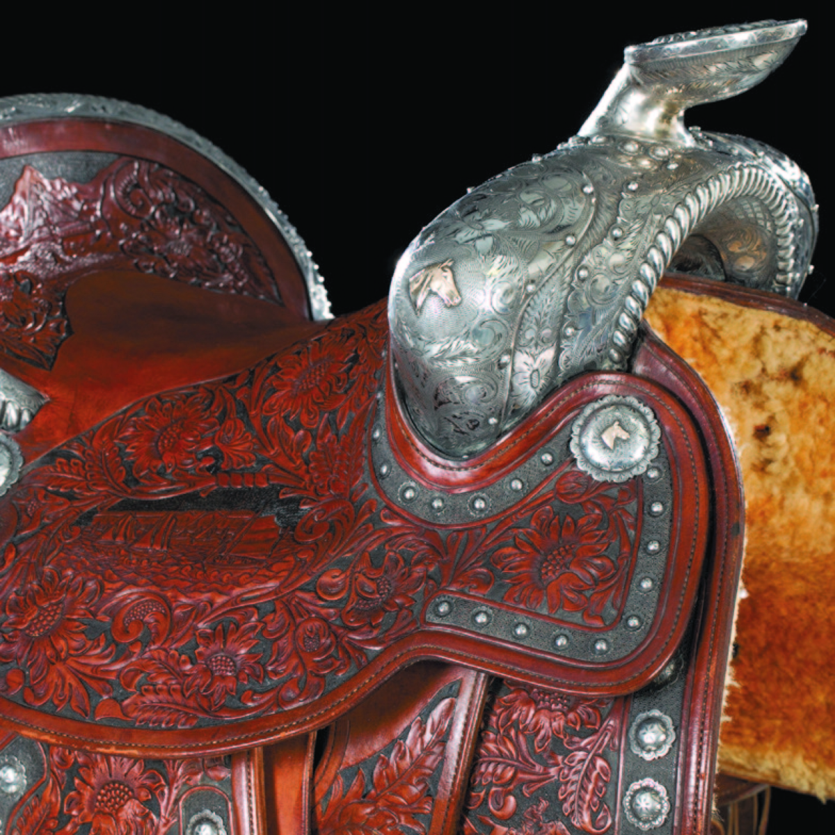 This Keyston Bros, San Francisco, exhibition, sterling silver-mounted saddle with intricate carving fetched $121,000.