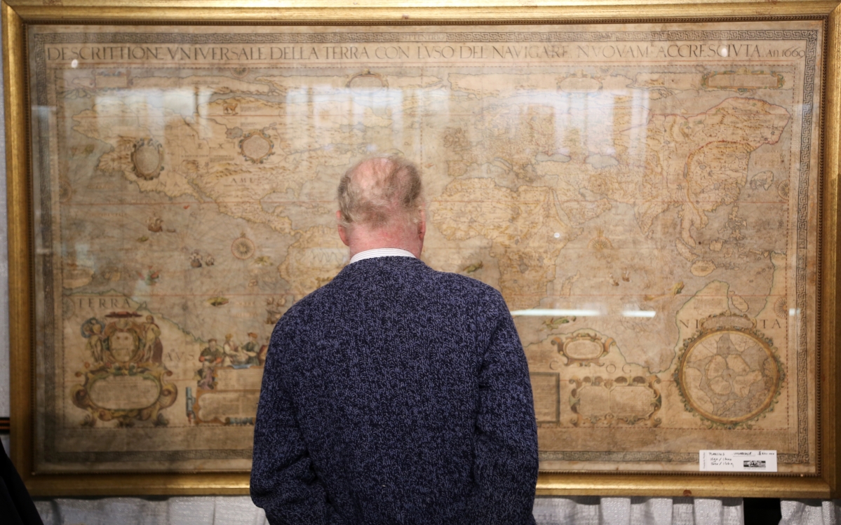 A man studies a Seventeenth Century map at Frederick Muller Rare Books, The Netherlands.