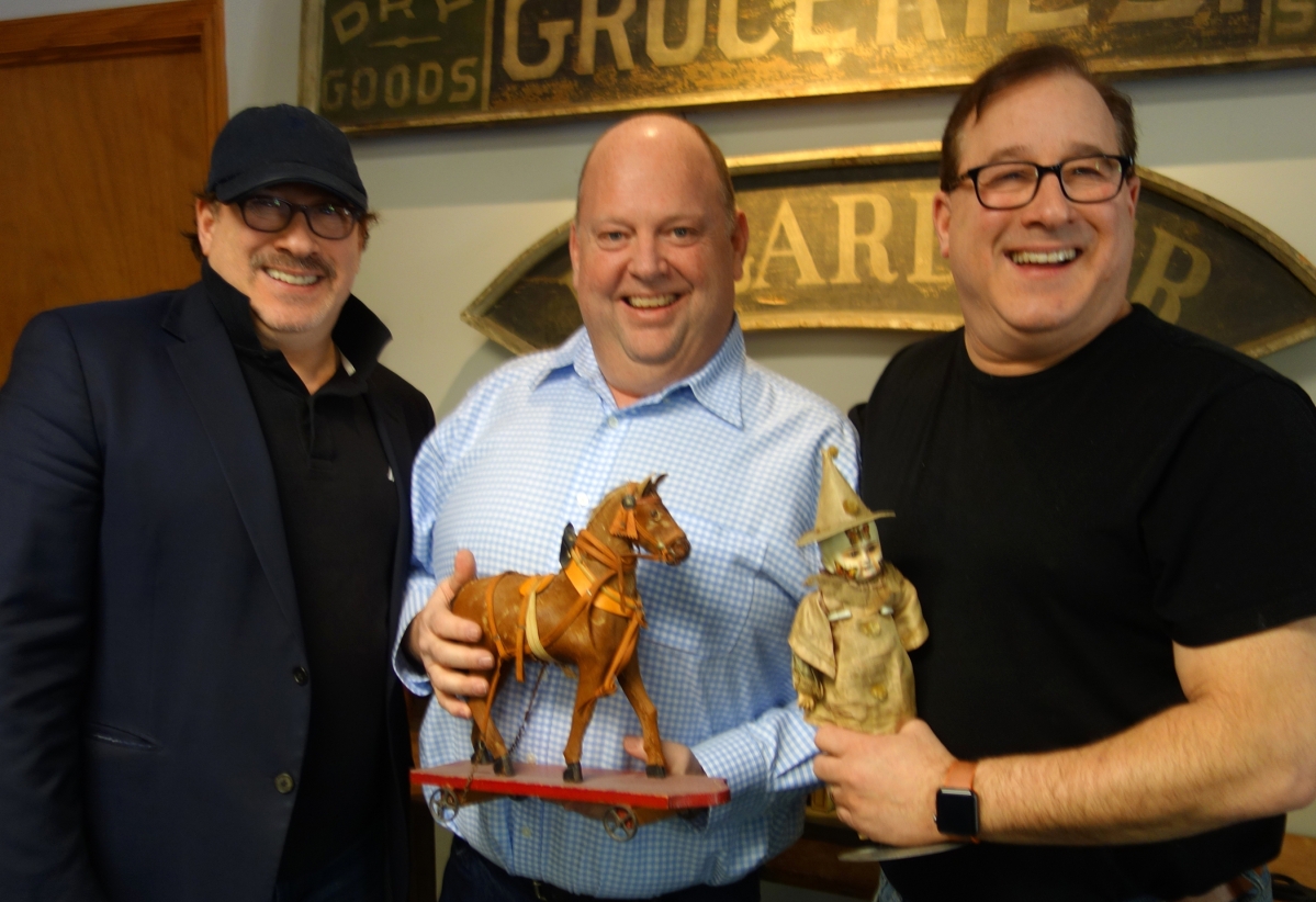 When the two-day auction was over on Sunday afternoon, this trio had good reason to be happy, for they are the force behind RSL Auctions. Shown in SRL order, from left, are Steven Weiss, Ray Haradin and Leon Weiss. There is a chance that the objects they are holding will cross the block some day at one of their sales.