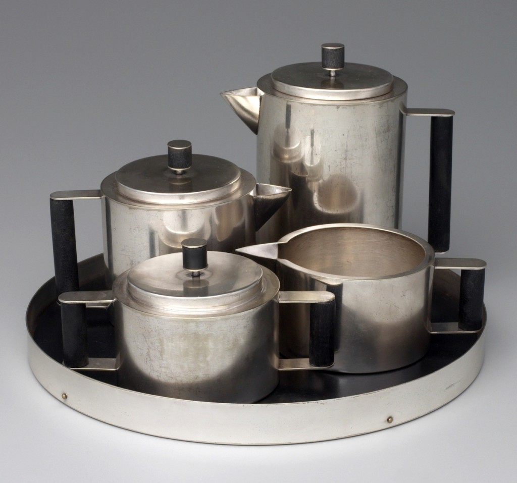 A Modern Tea and Coffee ServiceTea and coffee service, designer Ilonka Karasz, Paye and Baker Manufacturing Company, 1928. Electroplated nickel silver and Bakelite with brass. Gift of M. Josephine Dial in memory of Gregory T. Dial, BS 1930, Fund.Shortly after the exhibition “At Home in Manhattan: Modern Decorative Arts, 1925 to the Depression,” on view at Yale in late 1983 into early 1984, I became aware that the Manhattan gallery Fifty-Fifty still had material from Ilonka Karasz’s estate, including this service. One evening in New York my husband, Scott Braznell, harangued three curators — myself, Kevin Stayton of the Brooklyn Museum and Ulysses Dietz of Newark — about how this set had to be bought. He argued that it was a noteworthy work in American silver that eclipsed contemporaneous German Bauhaus silver. He analyzed its ingenious aspects of having all the pieces made with interchangeable parts from the same extruded cylinder for the bodies and the same rod of Bakelite for the handles. Furthermore, he noted it had belonged to Karasz herself. The exposition was delivered with such passion that the next day I called up dealer Mark McDonald and told him we wanted to pursue the purchase. The service has become an acknowledged icon of 1920s American design.