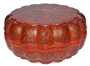 A Qing dynasty Tianqi polychrome lacquer painted lobed dragon box and cover brought $7,080. A similar example is in the collection of the Palace Museum in Beijing.