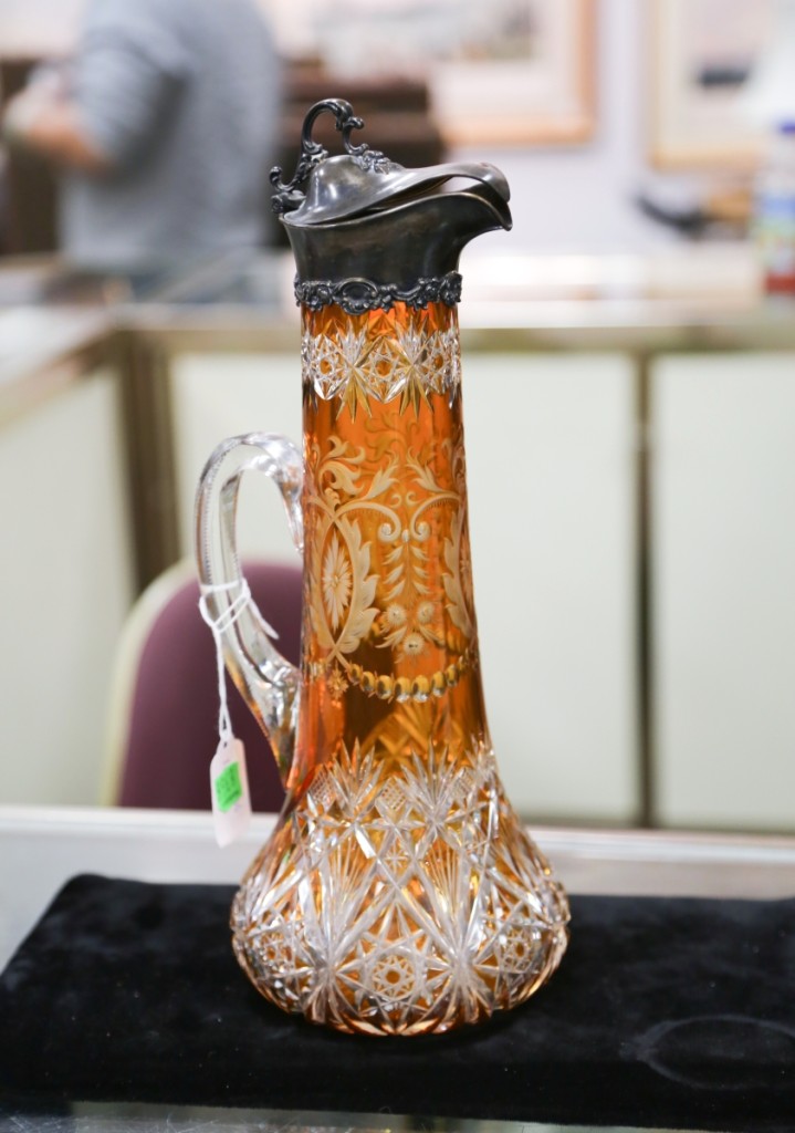 An amber cut-to-clear carafe with Gorham top surprised many at the sale when it fetched $18,000.