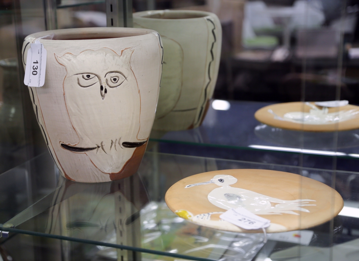 Pottery works by Pablo Picasso found considerable interest in this sale. The vase, left, was the top selling lot at $25,620. The plate next to it brought $3,048, both were from the New Haven, Conn. estate.