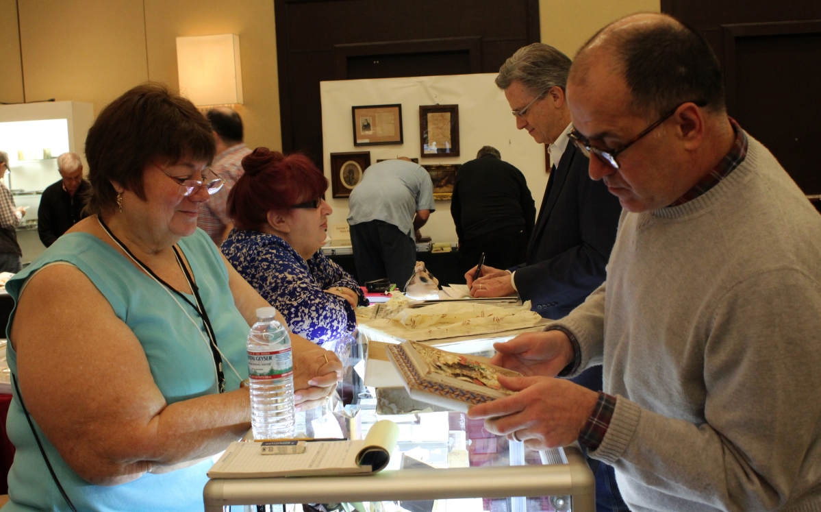Collector Michael Russo said he inherited the ephemera collecting gene from his late father Angelo M. “Russ” Russo, who lived in Milford, Conn., and collected holiday ephemera, especially Christmas, valentines and Halloween. Here Michael examines what is referred to as a “boxed valentine,” a multilayered confection popular in the 1870s, at the booth of Cardtique, Stillwater, Minn.