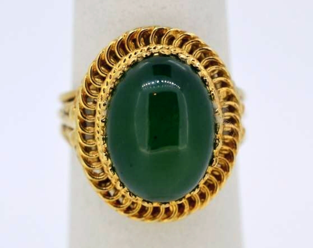 A vintage gold cocktail ring with center oval jade stone went out at $286.