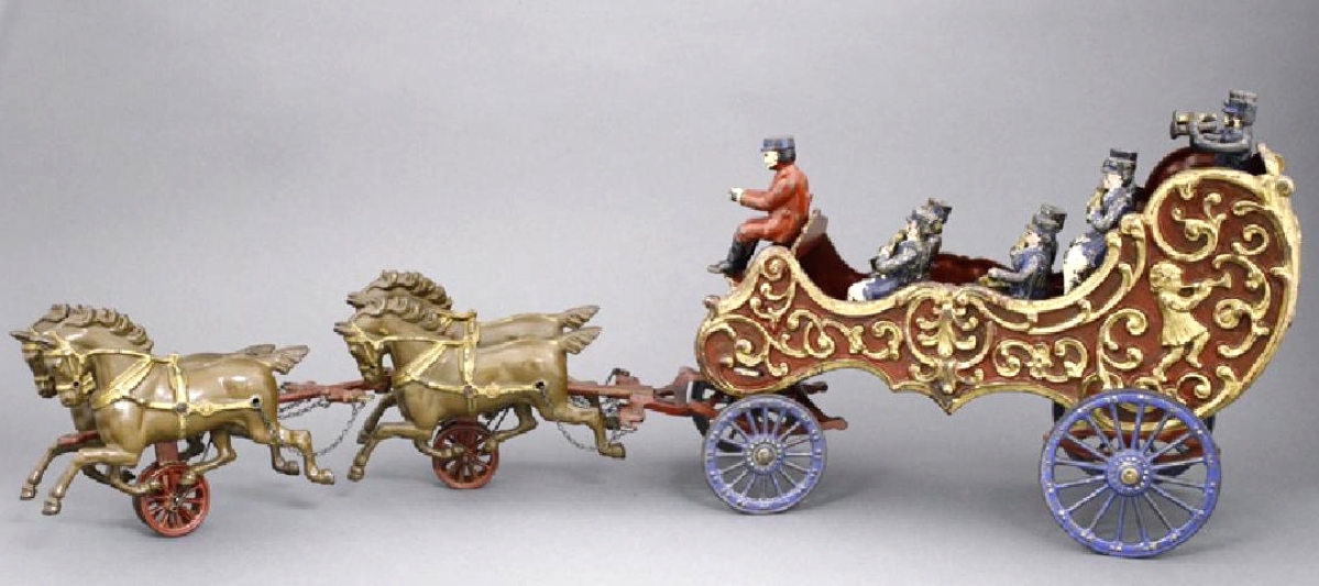 Lot 839, the horse-drawn Royal Circus Bandwagon by Hubley Mfg Co., Lancaster, Penn., circa 1906, measures 29 inches long. This large-size bandwagon, cast iron and tin, is in pristine condition, and all the figures are original to the toy. It realized $6,000.